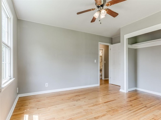 1125 E Fay St, Shawnee, OK 74801 - unfurnished bedroom with light wood-style flooring, a closet, and a ceiling fan