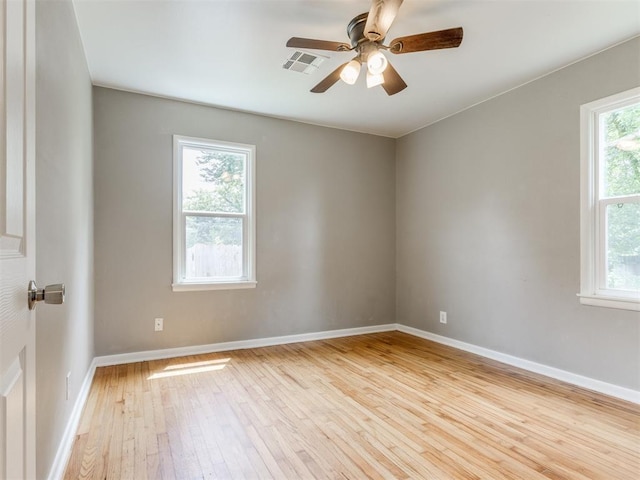 1125 E Fay St, Shawnee, OK 74801 - empty room with hardwood / wood-style flooring and a ceiling fan