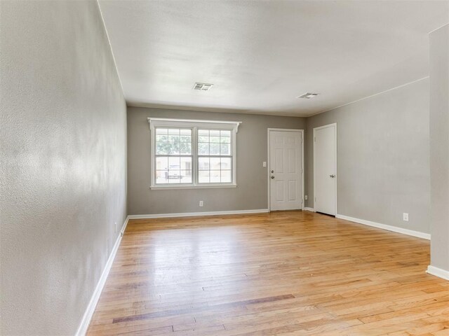 1125 E Fay St, Shawnee, OK 74801 - empty room with light wood-style flooring