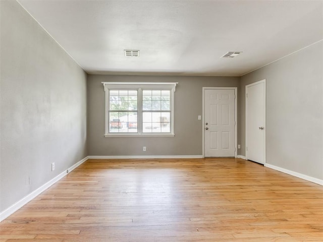 1125 E Fay St, Shawnee, OK 74801 - spare room with light wood-style flooring and baseboards