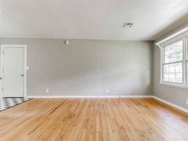 1125 E Fay St, Shawnee, OK 74801 - empty room with light wood-style floors and baseboards