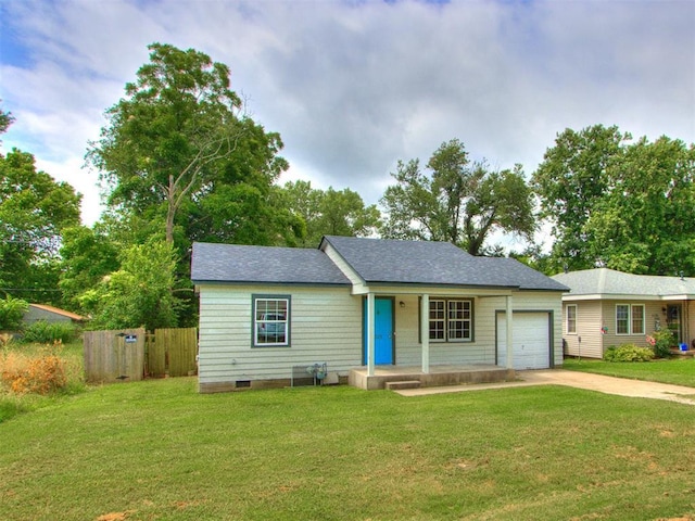1125 E Fay St, Shawnee, OK 74801 - view of front facade with an attached garage, driveway, and covered porch