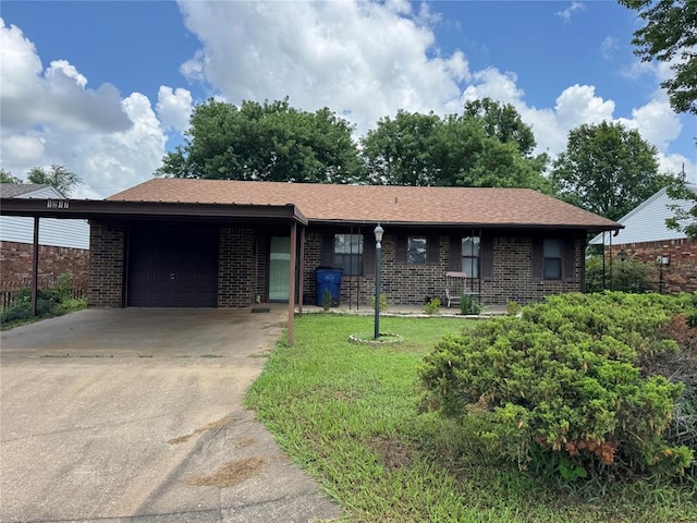 1217 Dove Hollow Dr, Tecumseh, OK 74873 - ranch-style house featuring brick siding, an attached garage, concrete driveway, and a front lawn