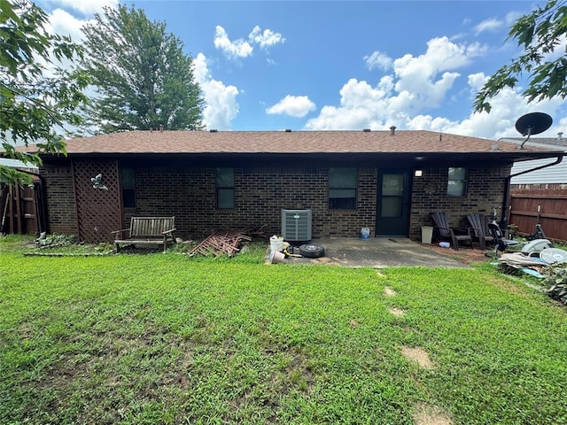 1217 Dove Hollow Dr, Tecumseh, OK 74873 - rear view of house featuring brick siding, a patio area, and a shingled roof