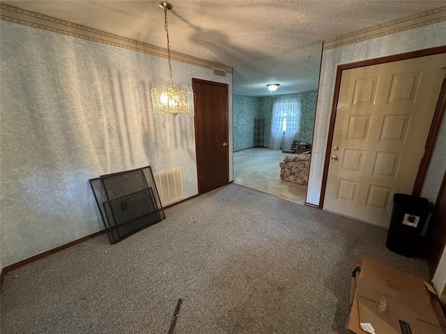 1217 Dove Hollow Dr, Tecumseh, OK 74873 - unfurnished living room featuring wallpapered walls, a textured ceiling, a chandelier, carpet, and ornamental molding