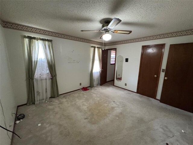 1217 Dove Hollow Dr, Tecumseh, OK 74873 - unfurnished room featuring a ceiling fan, a textured ceiling, and light colored carpet