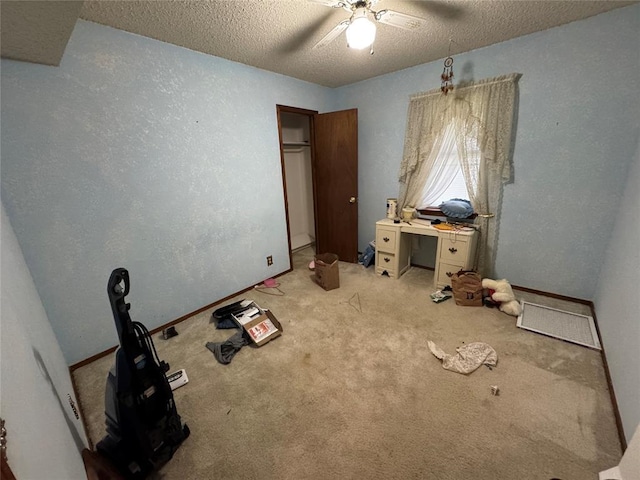 1217 Dove Hollow Dr, Tecumseh, OK 74873 - unfurnished bedroom featuring a textured ceiling, carpet floors, and ceiling fan