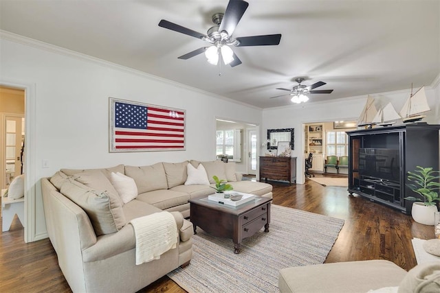 4201 Echohollow Trl, Edmond, OK 73025 - living area featuring crown molding, ceiling fan, and dark wood-style flooring