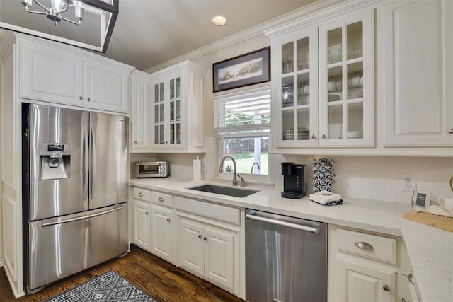 4201 Echohollow Trl, Edmond, OK 73025 - kitchen with stainless steel appliances, white cabinetry, ornamental molding, backsplash, and glass insert cabinets