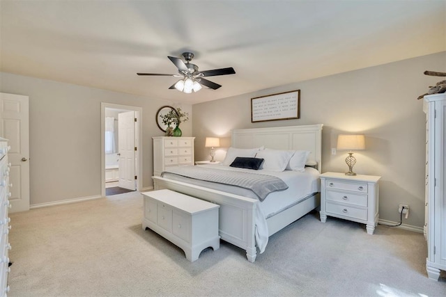 4201 Echohollow Trl, Edmond, OK 73025 - bedroom featuring light carpet, a ceiling fan, and ensuite bath