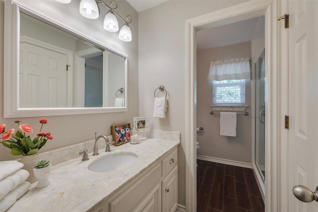 4201 Echohollow Trl, Edmond, OK 73025 - full bath featuring vanity, wood finish floors, and a stall shower
