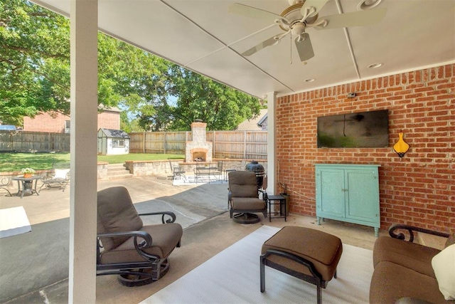 4201 Echohollow Trl, Edmond, OK 73025 - fenced backyard featuring a fireplace, a patio area, ceiling fan, and a shed