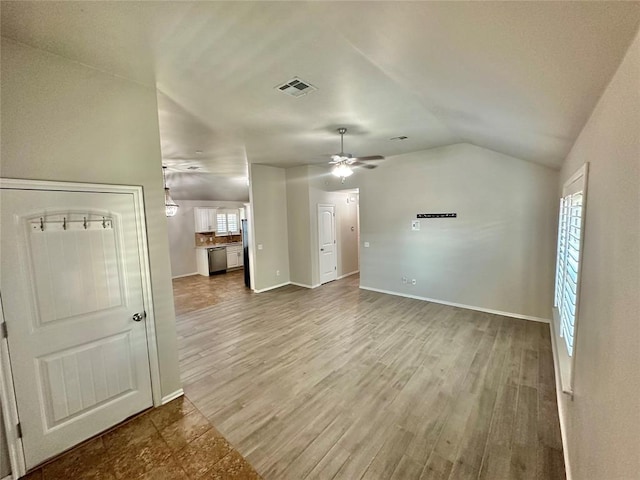 3600 Green Apple Pl, Moore, OK 73160 - unfurnished living room with lofted ceiling, wood finished floors, and ceiling fan