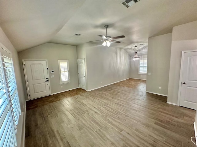 3600 Green Apple Pl, Moore, OK 73160 - unfurnished living room featuring a ceiling fan, wood finished floors, and lofted ceiling
