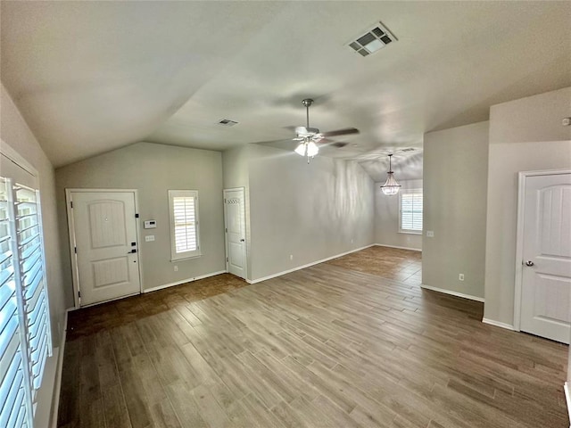 3600 Green Apple Pl, Moore, OK 73160 - unfurnished living room with a ceiling fan, wood finished floors, and vaulted ceiling