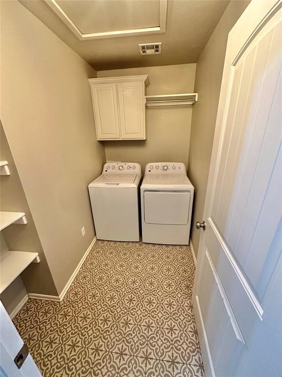 3600 Green Apple Pl, Moore, OK 73160 - laundry room featuring independent washer and dryer and cabinet space