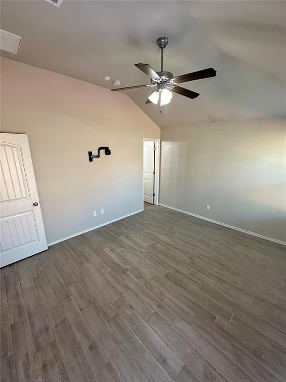 3600 Green Apple Pl, Moore, OK 73160 - spare room featuring a ceiling fan, vaulted ceiling, and dark wood-type flooring