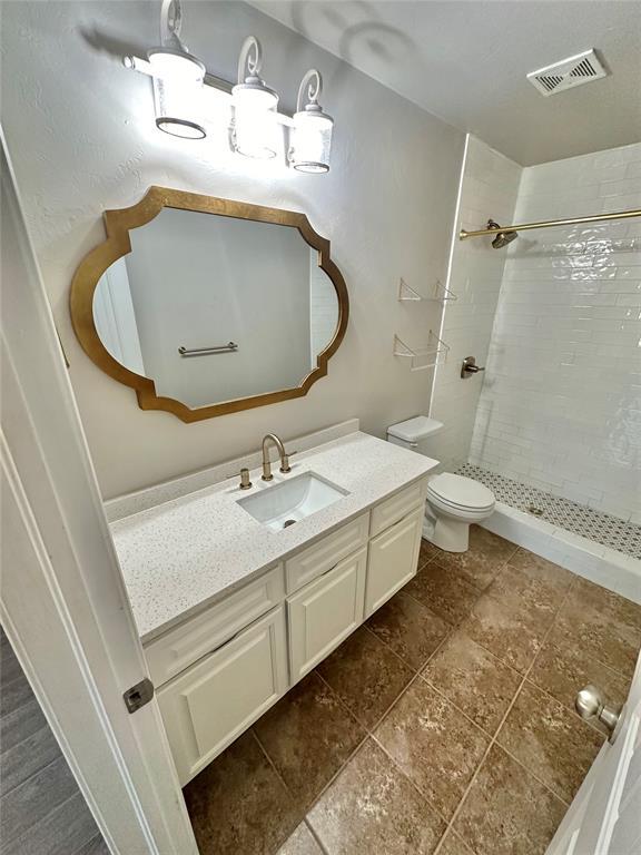 3600 Green Apple Pl, Moore, OK 73160 - full bathroom featuring vanity and tiled shower