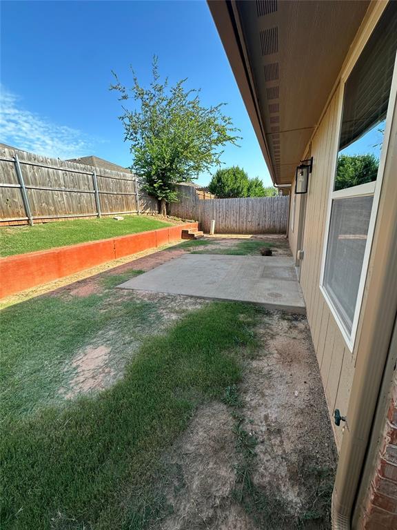 3600 Green Apple Pl, Moore, OK 73160 - fenced backyard featuring a patio area