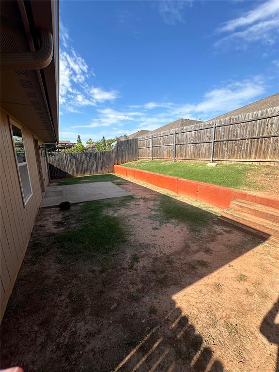 3600 Green Apple Pl, Moore, OK 73160 - fenced backyard featuring a patio