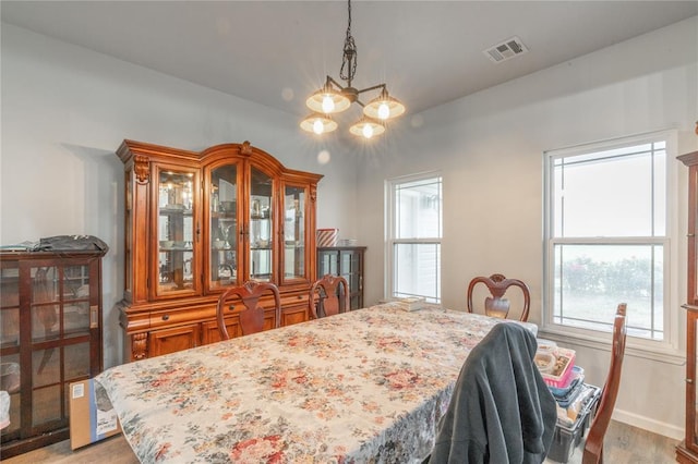 3356 E Maple Rd, Purcell, OK 73080 - dining room featuring a chandelier and light wood-style floors