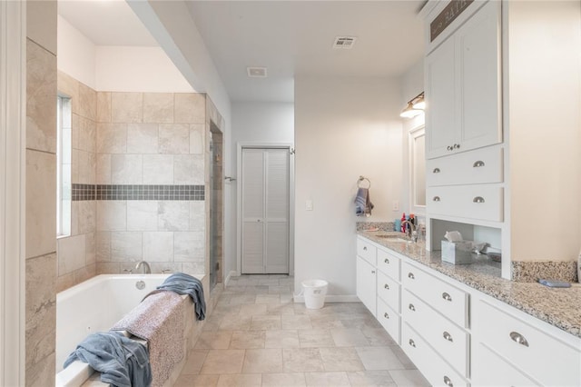 3356 E Maple Rd, Purcell, OK 73080 - full bath with vanity, a bath, and a shower with shower door