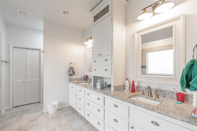 3356 E Maple Rd, Purcell, OK 73080 - bathroom featuring double vanity and a closet