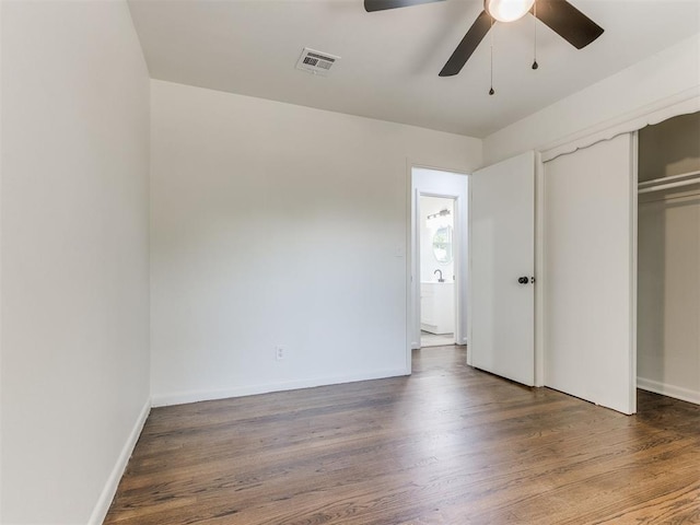 1420 SW 67th St, Oklahoma City, OK 73159 - unfurnished bedroom featuring wood finished floors, a closet, and a ceiling fan
