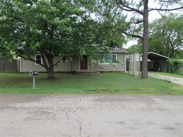 404 S 6th St, Tecumseh, OK 74873 - view of front facade with a carport, driveway, and crawl space