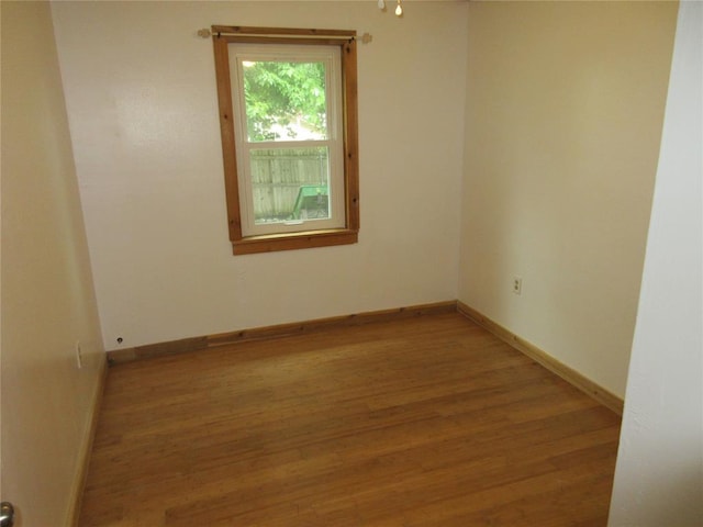 404 S 6th St, Tecumseh, OK 74873 - unfurnished room featuring wood finished floors and baseboards