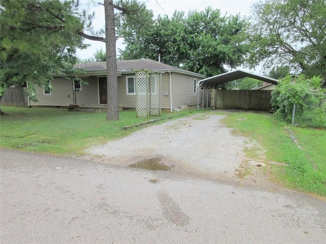 404 S 6th St, Tecumseh, OK 74873 - view of front facade with driveway and a detached carport
