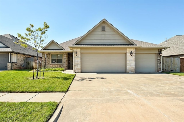 15728 Egerton Pl, Edmond, OK 73013 - view of front of home with an attached garage, concrete driveway, stone siding, and a shingled roof