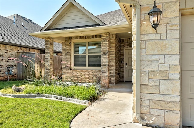 15728 Egerton Pl, Edmond, OK 73013 - property entrance featuring brick siding, a shingled roof, and covered porch