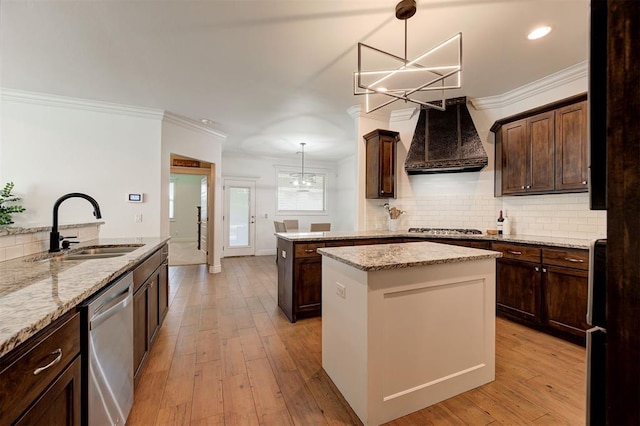 15728 Egerton Pl, Edmond, OK 73013 - kitchen featuring a chandelier, stainless steel appliances, custom range hood, a kitchen island, and dark brown cabinets