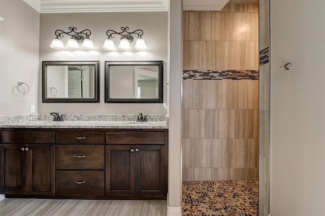 15728 Egerton Pl, Edmond, OK 73013 - full bath with double vanity, ornamental molding, walk in shower, and wood finished floors
