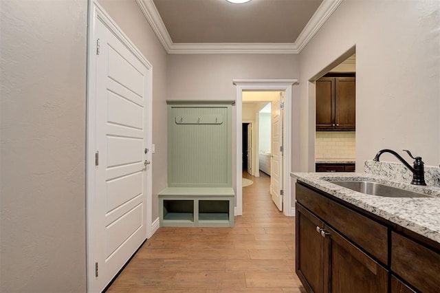 15728 Egerton Pl, Edmond, OK 73013 - hallway featuring crown molding and light wood-type flooring