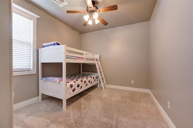 15728 Egerton Pl, Edmond, OK 73013 - carpeted bedroom with baseboards and a ceiling fan