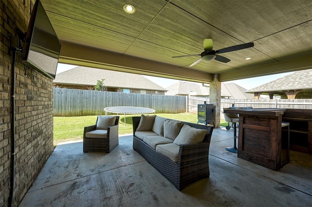 15728 Egerton Pl, Edmond, OK 73013 - fenced backyard with a patio, an outdoor hangout area, and ceiling fan