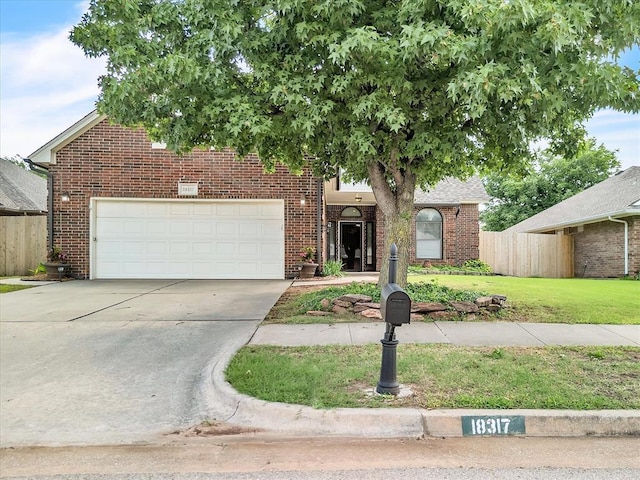 18317 Chestnut Oak Dr, Edmond, OK 73012 - view of front of home featuring brick siding and driveway