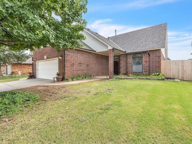 18317 Chestnut Oak Dr, Edmond, OK 73012 - view of front of home with a shingled roof, an attached garage, driveway, and brick siding
