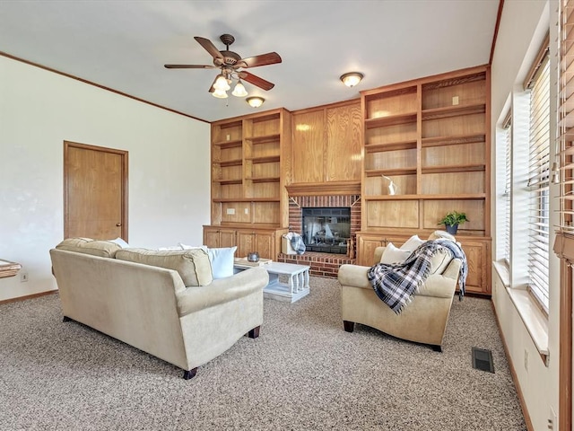 18317 Chestnut Oak Dr, Edmond, OK 73012 - living room with a ceiling fan, plenty of natural light, a brick fireplace, and carpet