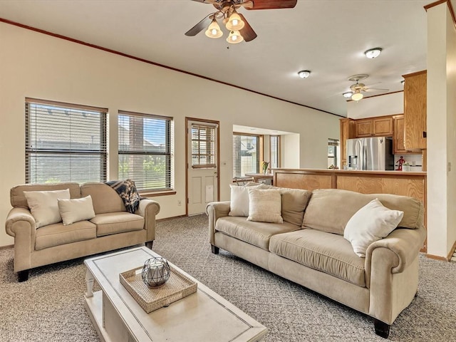 18317 Chestnut Oak Dr, Edmond, OK 73012 - living area featuring light colored carpet, a ceiling fan, and healthy amount of natural light