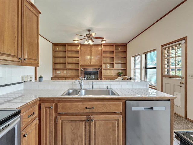18317 Chestnut Oak Dr, Edmond, OK 73012 - kitchen featuring appliances with stainless steel finishes, open shelves, a ceiling fan, a peninsula, and crown molding