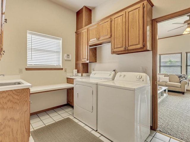 18317 Chestnut Oak Dr, Edmond, OK 73012 - washroom with washing machine and dryer, cabinet space, ceiling fan, and light tile patterned floors