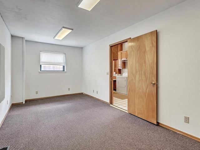 18317 Chestnut Oak Dr, Edmond, OK 73012 - spare room featuring washer / dryer and carpet floors