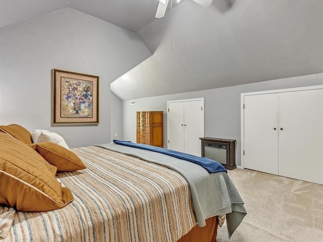 18317 Chestnut Oak Dr, Edmond, OK 73012 - bedroom with vaulted ceiling, light colored carpet, and ceiling fan