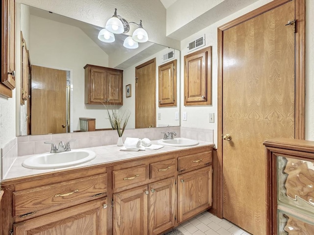 18317 Chestnut Oak Dr, Edmond, OK 73012 - full bathroom featuring double vanity and vaulted ceiling