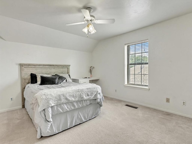 18317 Chestnut Oak Dr, Edmond, OK 73012 - bedroom featuring light carpet, ceiling fan, and vaulted ceiling