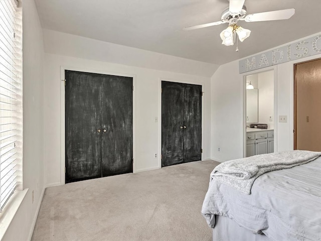 18317 Chestnut Oak Dr, Edmond, OK 73012 - carpeted bedroom featuring two closets, ensuite bath, and a ceiling fan