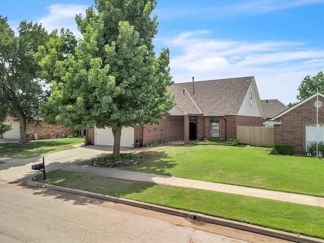 18317 Chestnut Oak Dr, Edmond, OK 73012 - view of front facade with brick siding, concrete driveway, and a shingled roof